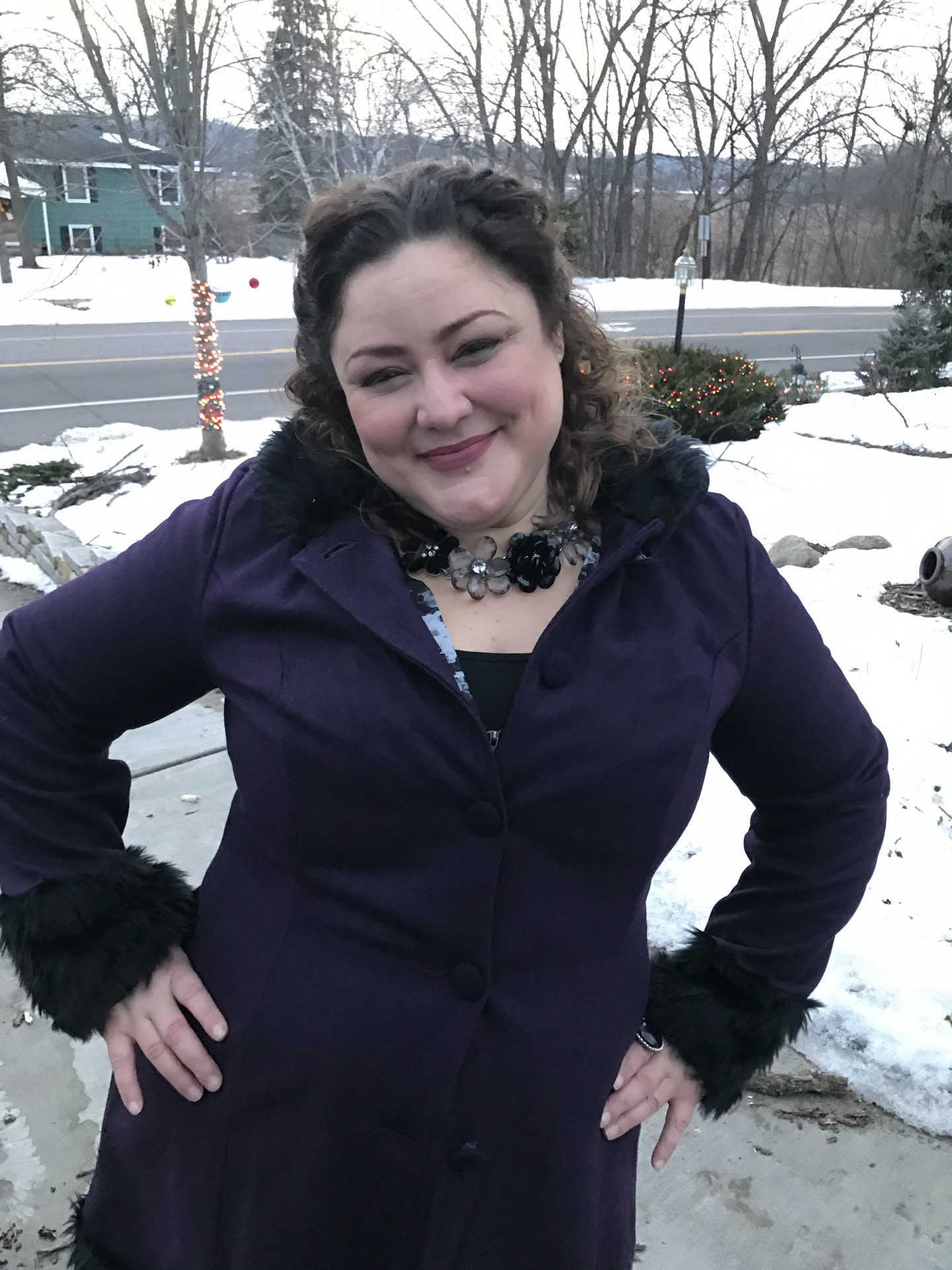 Fayemarie in a purple coat in the snow